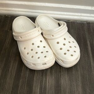 Platform white crocs.